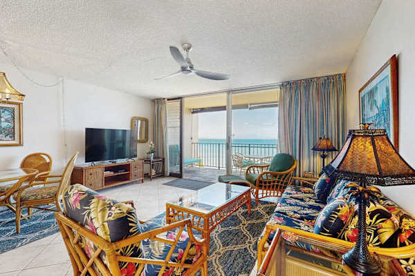 Relax in the inviting open-concept living room with beautiful ocean views just beyond the lanai.