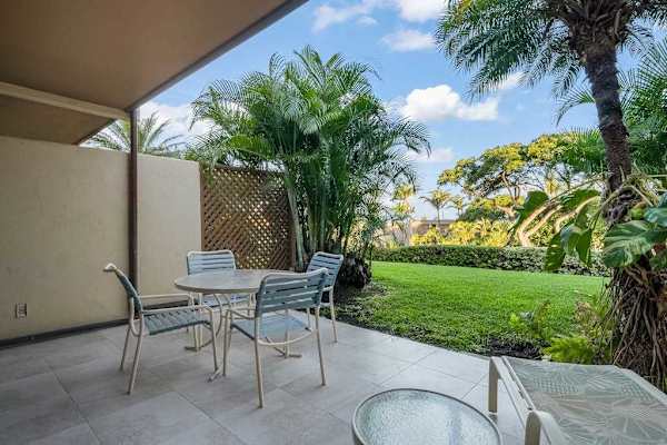 Shaded lanai table creates an easy setting for sunset cocktails