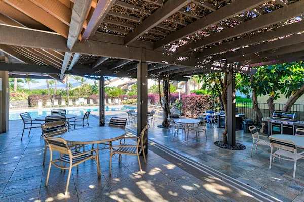 Shaded poolside patio for outdoor relaxation