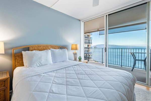 Master bedroom with a queen bed and private lanai.