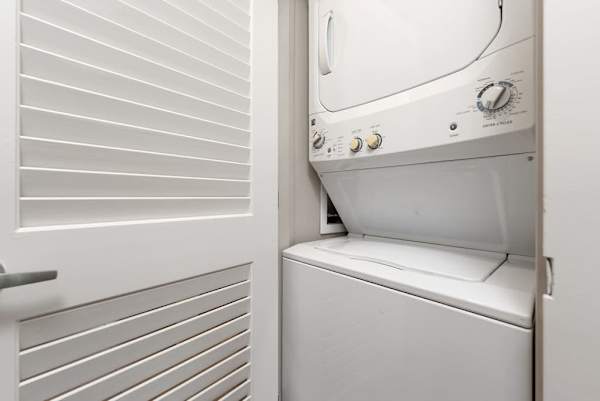 Washer and dryer are conveniently tucked inside a dedicated closet