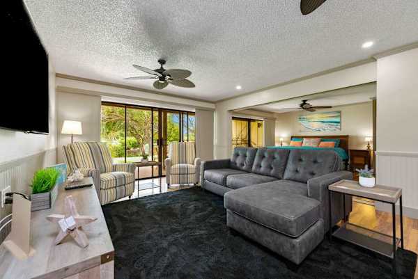 Inviting living room with sectional seating and bright garden views