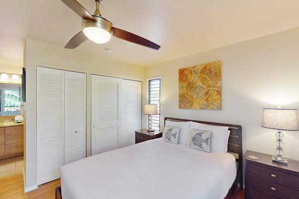 Cozy Bedroom with Queen Bed, Ceiling Fan, Bedside Tables, and En-Suite Access
