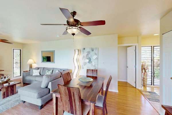 Warm Dining Space with Solid Wood Table Set and Open Layout Living View