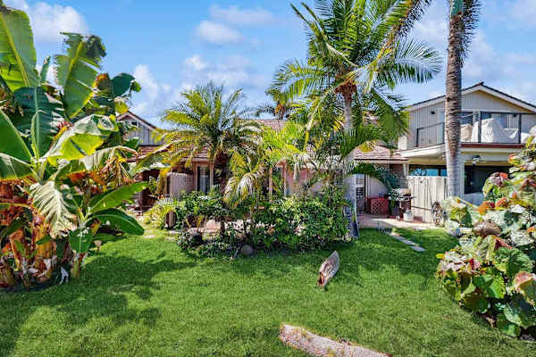 Lush tropical gardens create a peaceful outdoor retreat.