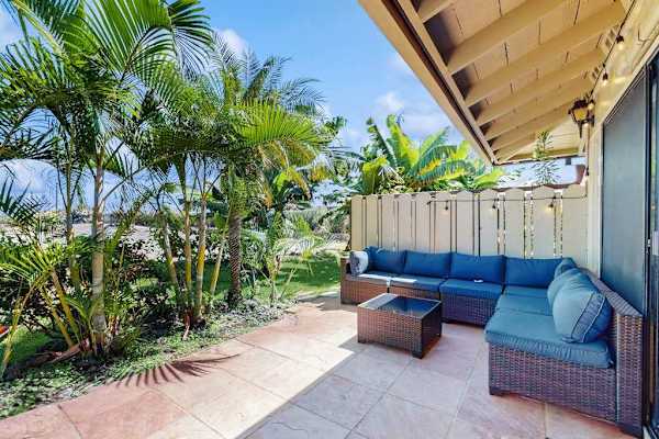 Enjoy outdoor lounging on your private patio surrounded by tropical gardens.