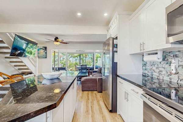 The open kitchen flows seamlessly into the living area for effortless entertaining.