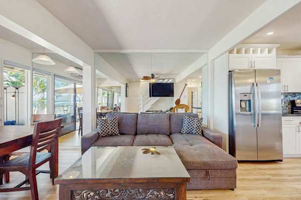 Relax in the bright open-concept living room with seamless indoor-outdoor living.