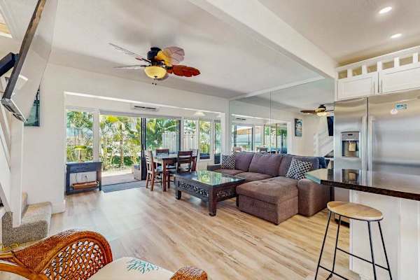 The bright open-concept living room is perfect for relaxing and gathering together.