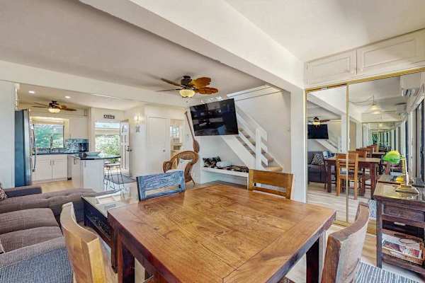 Gather around the dining table for memorable meals in a welcoming open layout.