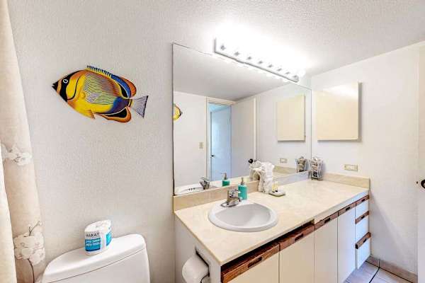 Spacious primary bathroom with plenty of counter and drawer space for your essentials
