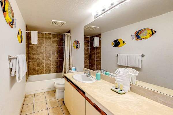 Bright primary bathroom with a bathtub perfect for a relaxing soak