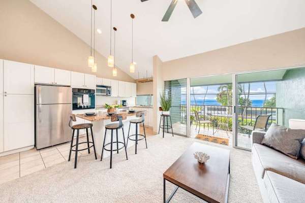 Open kitchen with island and breakfast bar