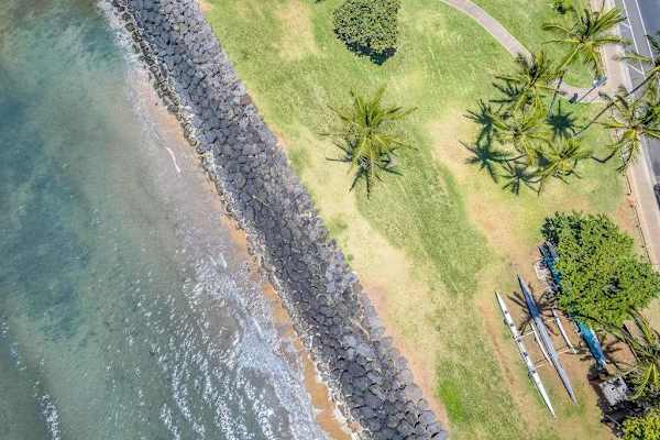 Aerial view of the rocky shoreline and green grounds