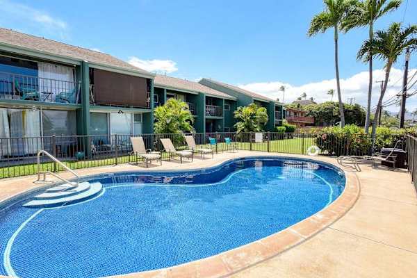 Sparkling community pool with lounge deck