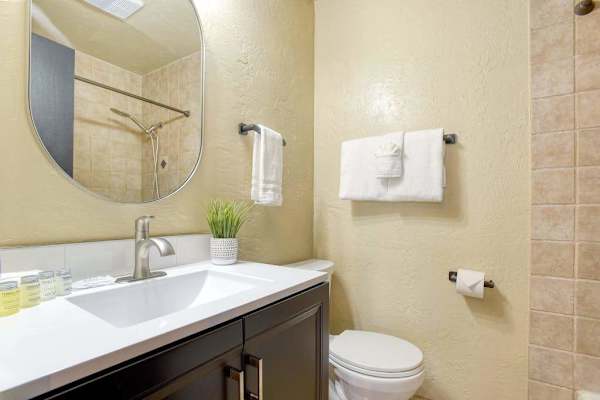 Bathroom with double vanity and elegant finishes