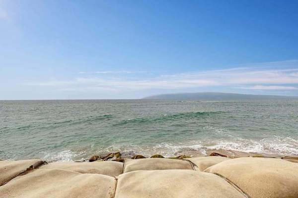 Rocky Shoreline With Endless Ocean Beauty