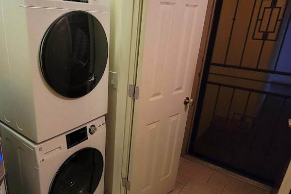 Convenient in-unit stacked washer and dryer for guest use