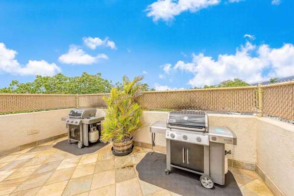 Outdoor BBQ grills and patio area for guest cookouts