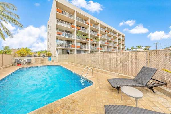 Refreshing outdoor pool and sun loungers for guest relaxation