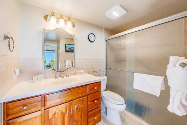 Full bathroom with spacious vanity and walk-in shower