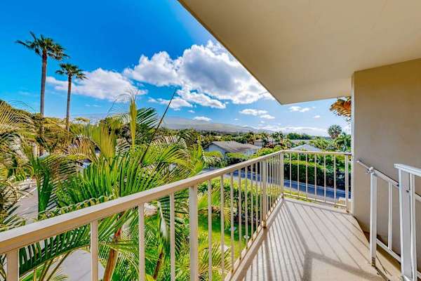 Balcony featuring lush tropical scenery.