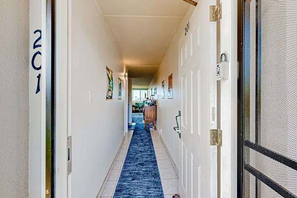 Entryway to the unit with an interior hallway.