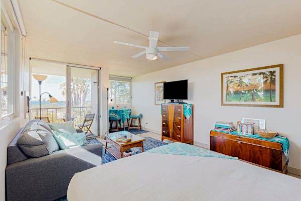 This cozy living room features a comfortable blue sofa and aesthetic views.