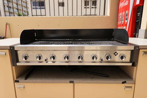 Grill favorite dishes in the welcoming shared BBQ area