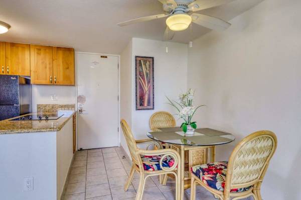 Open-concept dining space connects seamlessly to the fully equipped kitchen for added convenience.
