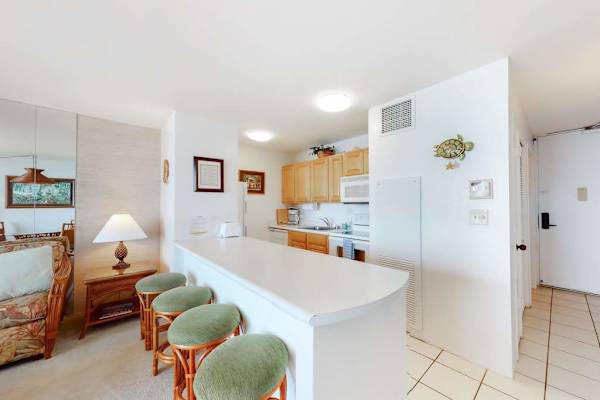Barstools with extra seating at the kitchen counter.  