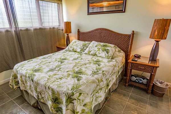 Comfortable queen bedroom with fresh linens for restful nights and peaceful mornings