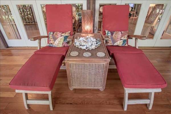 Spacious bench seating offers a relaxing spot to enjoy the tropical atmosphere