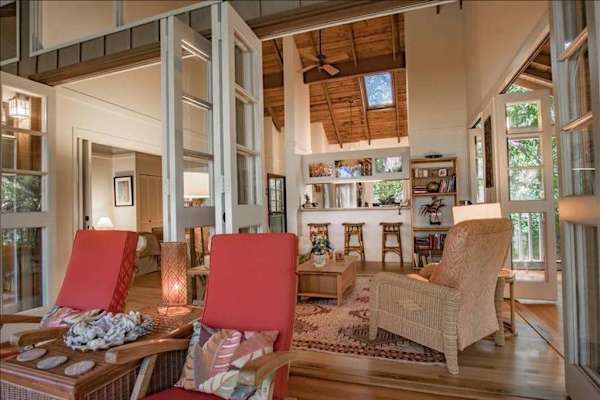 Beautiful receiving area welcomes guests with comfortable seating and inviting tropical atmosphere