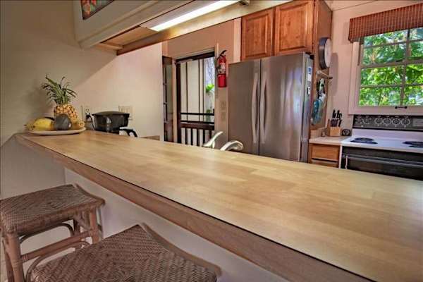 Bright kitchen with functional island creating extra space for meal preparation daily