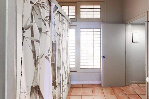 Clean full bathroom designed for comfort with practical amenities and fresh towels