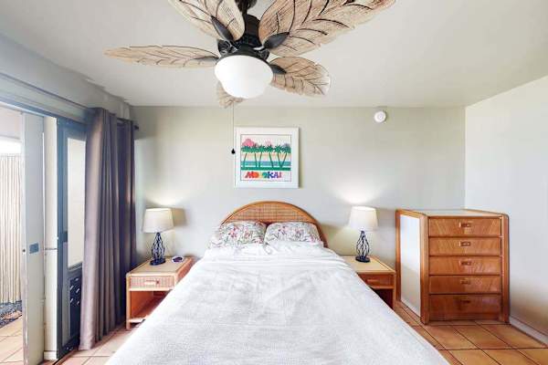 First bedroom featuring comfortable queen bed with fresh linens for restful sleep