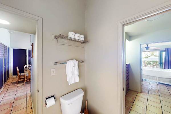 Modern full bathroom featuring spacious vanity and thoughtfully arranged guest essentials throughout