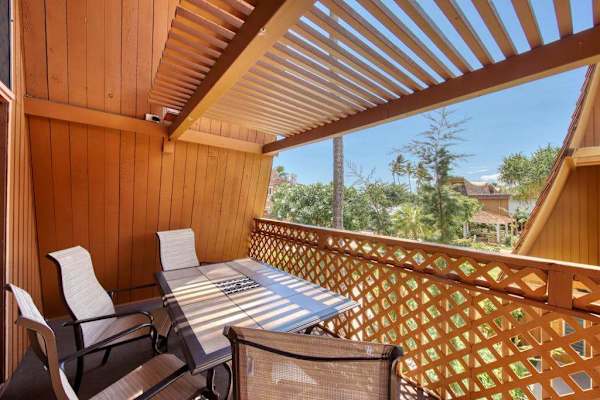Balcony dining space overlooking tropical surroundings for memorable meals and relaxing moments together
