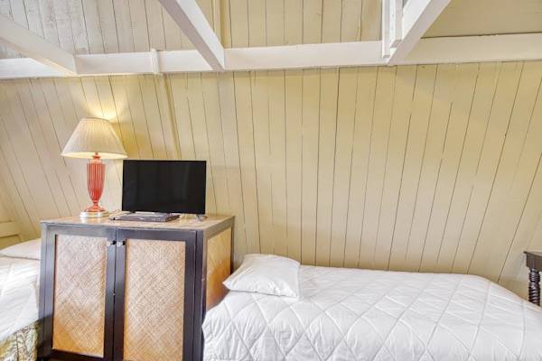 Spacious studio combines sleeping area and TV for effortless comfort throughout your stay