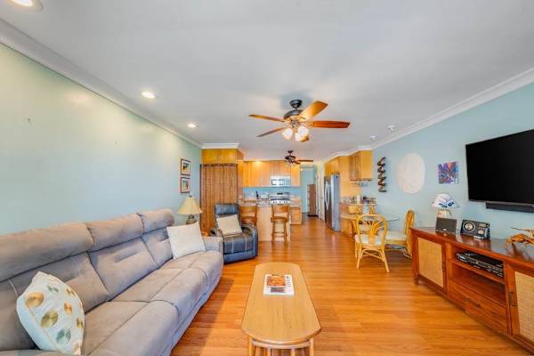 Thoughtfully designed living room offers comfortable seating and a bright welcoming atmosphere throughout