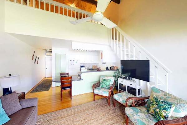 Bright open concept living room offers inviting seating and seamless shared living spaces