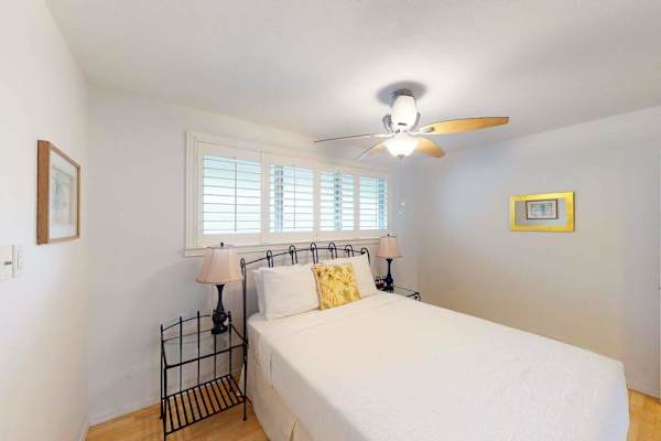 Peaceful bedroom with ceiling fan keeps the space cool and inviting every night