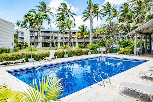Beautiful pool creates the perfect backdrop for memorable vacation days under blue skies