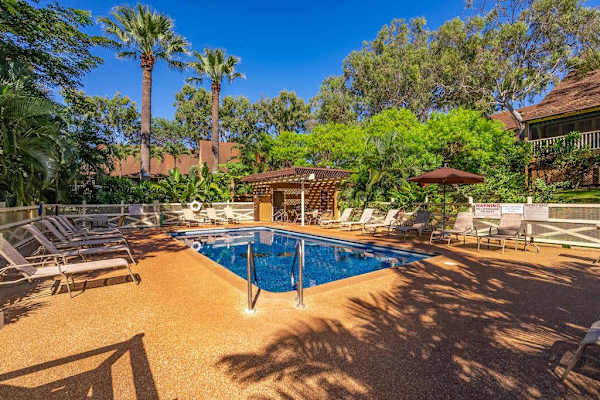 Refresh your day with a relaxing swim in this beautifully maintained tropical pool
