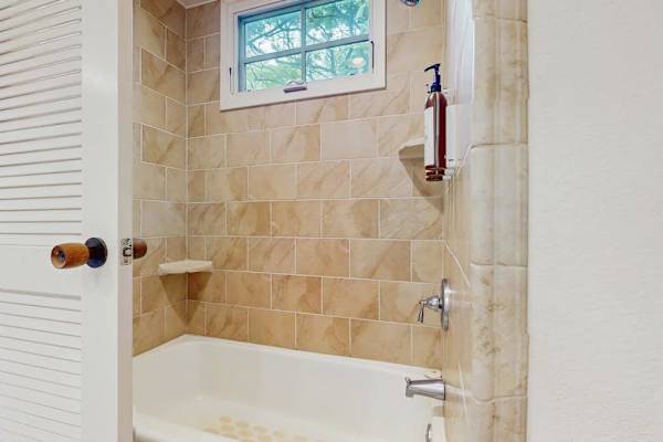 Bright bathroom welcomes you with a clean spacious layout and refreshing everyday comfort
