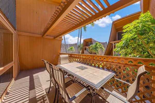 Balcony offers outdoor seating with greenery and ocean breeze