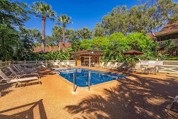 Refresh yourself in the sparkling resort pool surrounded by tropical island beauty