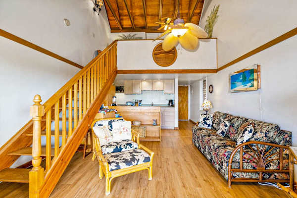 Island-inspired living room includes comfortable seating and decorative artwork