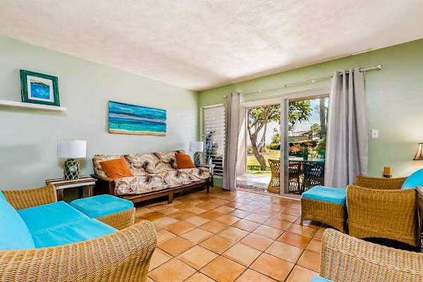 Bright living room with colorful seating and direct garden access
